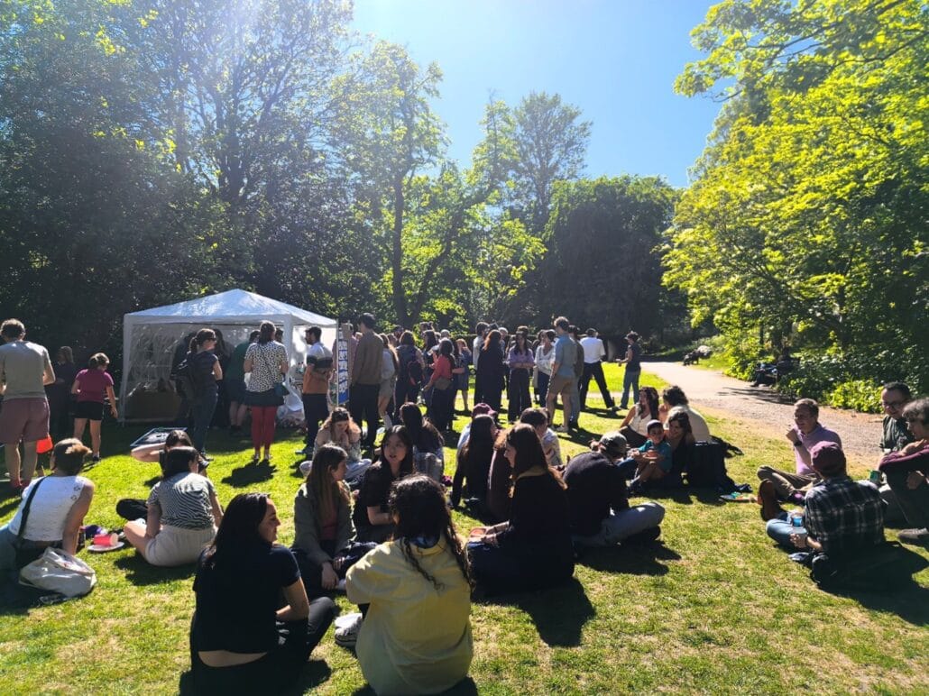 Guests enjoying refreshments and conversations in the garden
